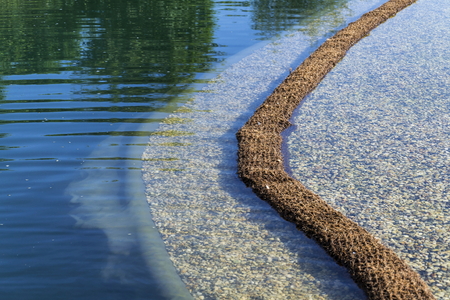 Textile fabric net in natural swimming pond for purifying plantsの写真素材