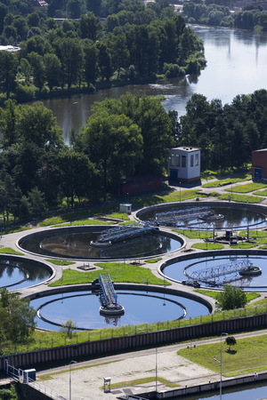 Sewage water treatment plant with river in background aerial viewの写真素材