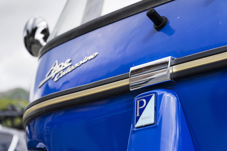 LIVIGNO, ITALY - AUGUST 1: Limited edition model of three-wheeled vehicle Piaggio Ape Calessino stands on street on 1 August 2016 in Livigno, Italy.のeditorial素材