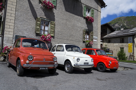 LIVIGNO, ITALY - AUGUST 1: Three vintage cars stand on street on 1 August 2016 in Livigno, Italy.のeditorial素材