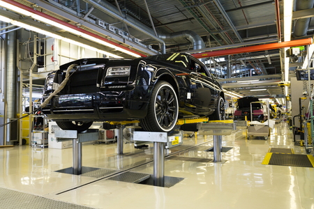 WESTHAMPNETT, UNITED KINGDOM - AUGUST 11: Rolls-Royce cars stand on production line in Goodwood factory on August 11, 2016 in Westhampnett, United Kingdom. Rolls-Royce skips Paris Motor Show.のeditorial素材