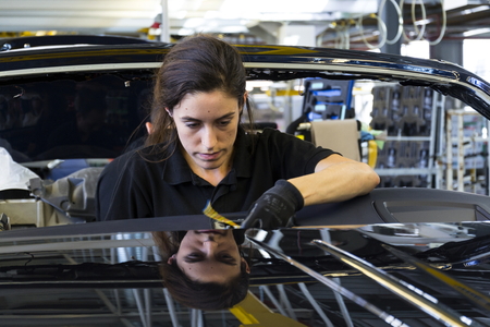 WESTHAMPNETT, UNITED KINGDOM - AUGUST 11: Rolls-Royce cars stand on production line in Goodwood factory on August 11, 2016 in Westhampnett, United Kingdom. Rolls-Royce skips Paris Motor Show.のeditorial素材