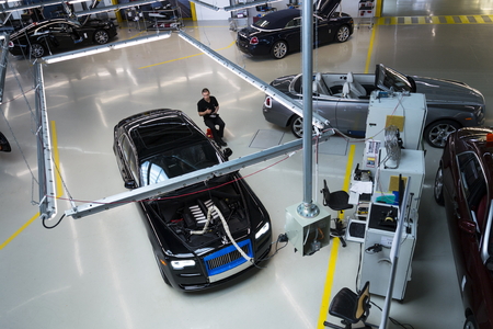 WESTHAMPNETT, UNITED KINGDOM - AUGUST 11: Rolls-Royce cars stand on production line in Goodwood factory on August 11, 2016 in Westhampnett, United Kingdom. Rolls-Royce skips Paris Motor Show.のeditorial素材