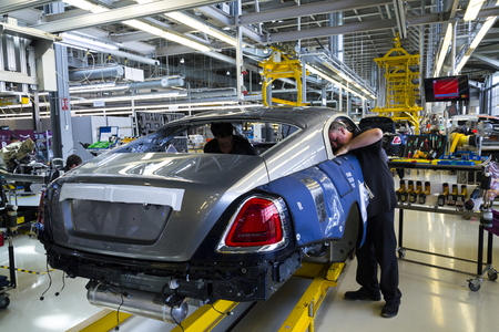 WESTHAMPNETT, UNITED KINGDOM - AUGUST 11: Rolls-Royce cars stand on production line in Goodwood factory on August 11, 2016 in Westhampnett, United Kingdom. Rolls-Royce skips Paris Motor Show.のeditorial素材