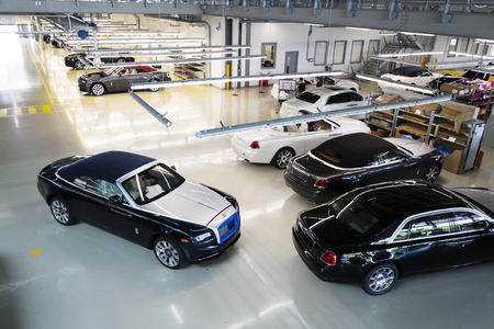 WESTHAMPNETT, UNITED KINGDOM - AUGUST 11: Rolls-Royce cars stand on production line in Goodwood factory on August 11, 2016 in Westhampnett, United Kingdom. Rolls-Royce skips Paris Motor Show.のeditorial素材