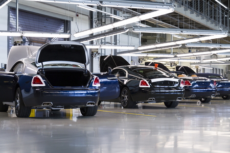 WESTHAMPNETT, UNITED KINGDOM - AUGUST 11: Rolls-Royce cars stand on production line in Goodwood factory on August 11, 2016 in Westhampnett, United Kingdom. Rolls-Royce skips Paris Motor Show.のeditorial素材