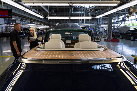 WESTHAMPNETT, UNITED KINGDOM - AUGUST 11: Rolls-Royce cars stand on production line in Goodwood factory on August 11, 2016 in Westhampnett, United Kingdom. Rolls-Royce skips Paris Motor Show.のeditorial素材