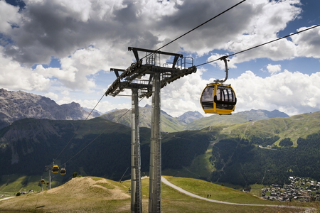 Cable car gondola in Alps mountains near Livigno lake Italyの写真素材