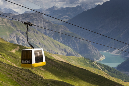 Cable car gondola in Alps mountains near Livigno lake Italyのeditorial素材