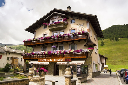 LIVIGNO, ITALY - AUGUST 1: Tourists shopping on the streets of duty-free area on 1 August 2016 in Livigno, Italy.のeditorial素材