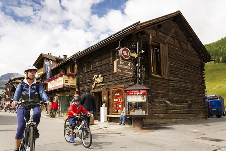 LIVIGNO, ITALY - AUGUST 1: Tourists shopping on the streets of duty-free area on 1 August 2016 in Livigno, Italy.のeditorial素材