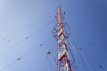 Men painting the highest Czech construction radio transmitter tower Liblice の写真素材