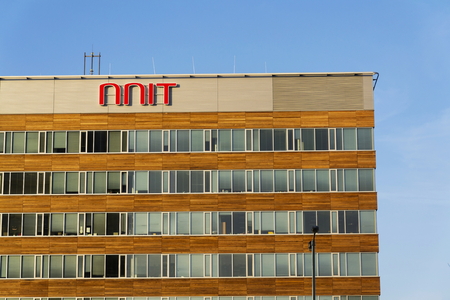 PRAGUE, CZECH REPUBLIC - DECEMBER 16: NNIT international IT service provider company logo on Czech headquarters building on December 16, 2016 in Prague, Czech republic.のeditorial素材