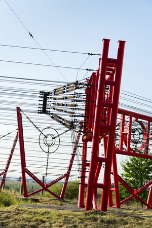 Communication wires lead to switching station from radio transmitter towerの写真素材