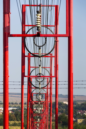 Communication wires lead to switching station from radio transmitter towerの写真素材