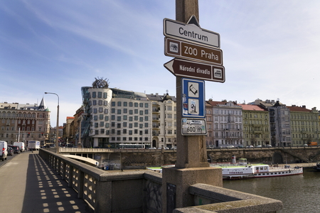 PRAGUE, CZECH REPUBLIC - MARCH 3: Boat floating in front of the Dancing House, nicknamed Fred and Ginger, completed in 1996 for Nationale-Nederlanden by Vlado Milunic and Frank Gehry on March 3, 2017 in Prague, Czech republic.のeditorial素材