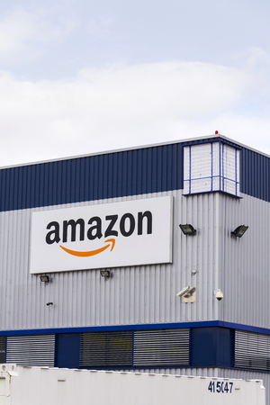 DOBROVIZ, CZECH REPUBLIC - MARCH 12: Amazon electronic commerce company logo on logistics building on March 12, 2017 in Dobroviz, Czech republic. Amazon.com is getting a Spanish language option.のeditorial素材