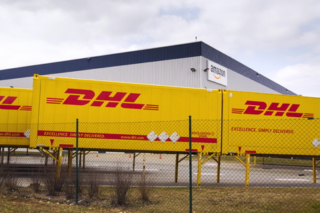 DOBROVIZ, CZECH REPUBLIC - MARCH 12: DHL shipping containers in front of Amazon logistics building on March 12, 2017 in Dobroviz, Czech republic.のeditorial素材