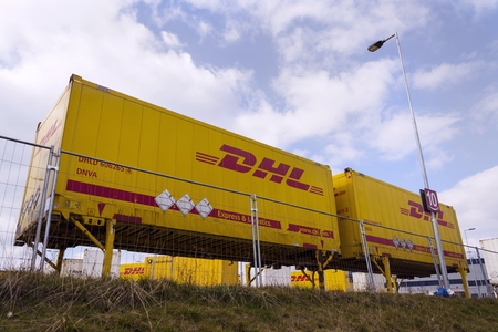 DOBROVIZ, CZECH REPUBLIC - MARCH 12: DHL shipping containers in front of Amazon logistics building on March 12, 2017 in Dobroviz, Czech republic.のeditorial素材