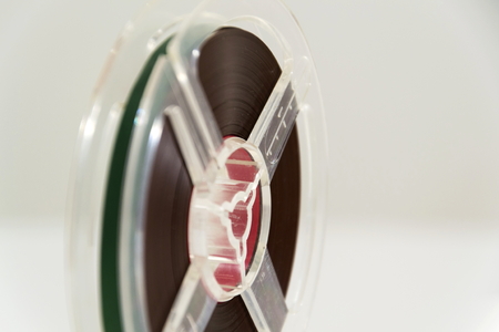Vintage reel-to-reel audio recorder tape isolated on white backgroundの写真素材