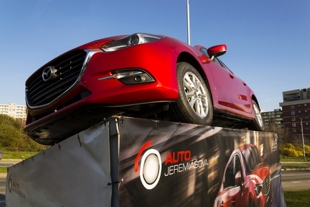 PRAGUE, CZECH REPUBLIC - MARCH 31: Mazda 3 car in front of dealership building on March 31, 2017 in Prague, Czech republic. Mazda set to launch new electric vehicle range by 2019.のeditorial素材