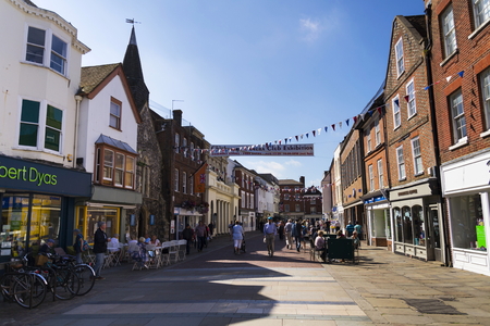 CHICHESTER, UNITED KINGDOM - AUGUST 12: People walk on street on August 12, 2016 in Chichester,...