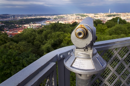 Public telescope with Prague city center in background, Czech republicの写真素材