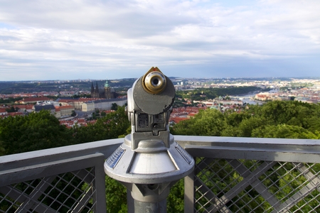 Public telescope with Prague city center in background, Czech republicの写真素材