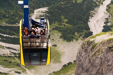 RAMSAU AM DACHSTEIN, AUSTRIA - AUGUST 17: Tourists on top of gondola in the upper station of the Dachstein cable car on August 17, 2017 in Schladming, Austria.のeditorial素材