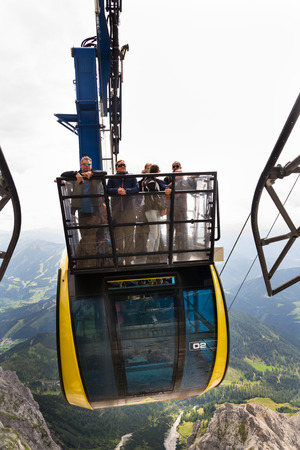 RAMSAU AM DACHSTEIN, AUSTRIA - AUGUST 17: Tourists on top of gondola in the upper station of the Dachstein cable car on August 17, 2017 in Schladming, Austria.のeditorial素材