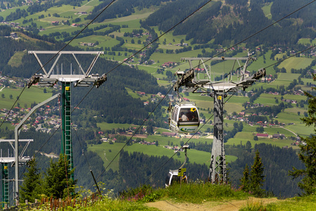 SCHLADMING, AUSTRIA - AUGUST 15: Tourists travel in cable car to Planai bike and ski areal on August...