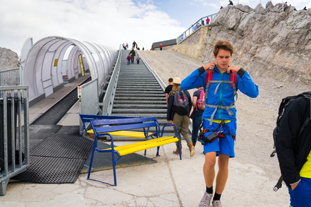 RAMSAU AM DACHSTEIN, AUSTRIA - AUGUST 17: Ski lift with people walking to Dachstein glacier on August 17, 2017 in Ramsau am Dachstein, Austria.のeditorial素材