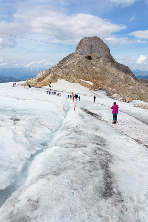 RAMSAU AM DACHSTEIN, AUSTRIA - AUGUST 17: People hiking on Gjaidstein Mountain adventure trail near Dachstein glacier on August 17, 2017 in Ramsau am Dachstein, Austria.のeditorial素材
