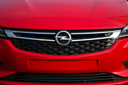 PRAGUE, CZECH REPUBLIC - NOVEMBER 5: Opel company logo on car in front of dealership building on November 5, 2017 in Prague. PSA Group plans to cut the number of models and rein in discounts at its Opel division.のeditorial素材