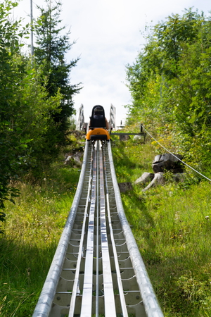 Bobsled Roller Coaster Toboggan in summer day, Rittisberg, Alps, Austriaの写真素材