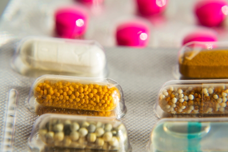 Colorful pills in transparent medicine capsule, nanotechnology future medicine conceptの写真素材