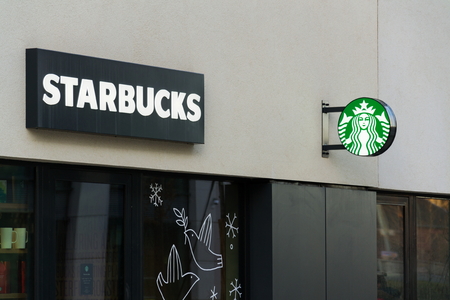 PRAGUE, CZECH REPUBLIC - JANUARY 6: Starbucks coffee company logo on cafe building on January 6, 2018 in Prague, Czech Republic.のeditorial素材