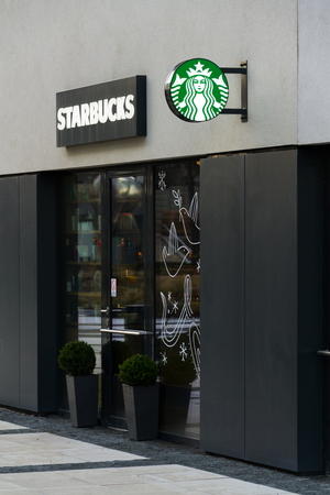 PRAGUE, CZECH REPUBLIC - JANUARY 6: Starbucks coffee company logo on cafe building on January 6, 2018 in Prague, Czech Republic.のeditorial素材