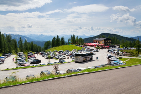 RAMSAU AM DACHSTEIN, AUSTRIA - AUGUST 17 2017: Parking lot at Alps Mountains under Dachstein Glacier Hunerkogel mountain cable car lower station on August 17, 2017 in Ramsau am Dachstein, Austria.のeditorial素材