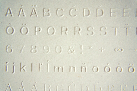 Embossed writing for blind people used before Braille writing systemの写真素材