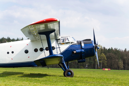 PLASY, CZECH REPUBLIC - APRIL 30: Blue-white Antonov An-2 preparing for takeoff on airfield on April 30, 2017 in Plasy, Czech Republic.のeditorial素材
