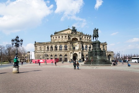 DRESDEN, GERMANY - APRIL 2 2018: People in front of King Johann horse rider statue, John of Saxony Monument and opera house Semperoper concert hall on April 2, 2018 in Dresden, Germany.のeditorial素材