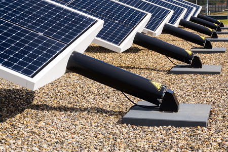 Blue rotating solar panels tilted axis tracker, future energy concept