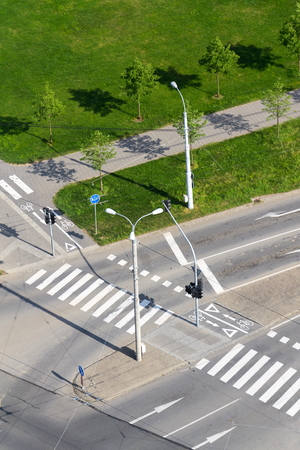 Crosswalk and bike crossing line on empty crossroad, driverless technologyの写真素材