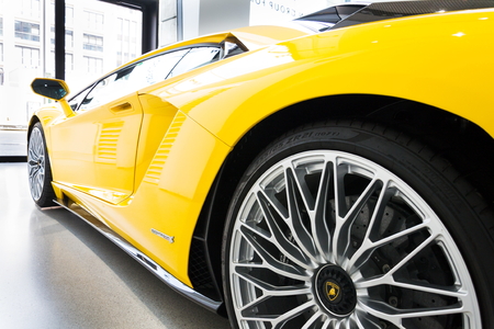 BERLIN, GERMANY - APRIL 15 2018: Lamborghini company logo on Lamborghini Aventador S coupe standing at Volkswagen Group forum Drive on April 15, 2018 in Berlin, Germany.のeditorial素材