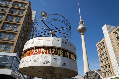 BERLIN, GERMANY - APRIL 15 2018: Urania World Clock from 1969 on public square of Alexanderplatz with Fernsehturm televison tower on April 15, 2018 in Berlin, Germany.のeditorial素材