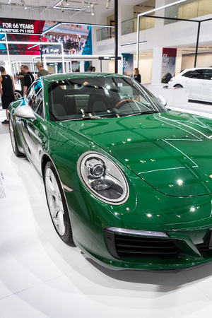 BERLIN, GERMANY - APRIL 15 2018: Porsche 911 Carrera S green car standing at Volkswagen Group forum Drive on April 15, 2018 in Berlin, Germany.のeditorial素材