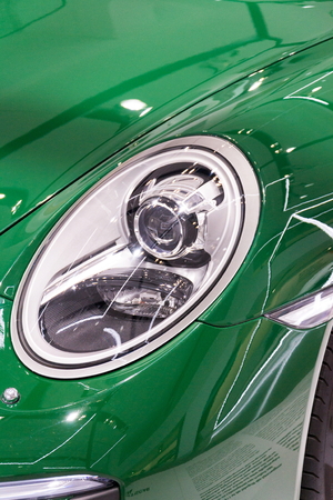 BERLIN, GERMANY - APRIL 15 2018: Porsche 911 Carrera S green car standing at Volkswagen Group forum Drive on April 15, 2018 in Berlin, Germany.のeditorial素材