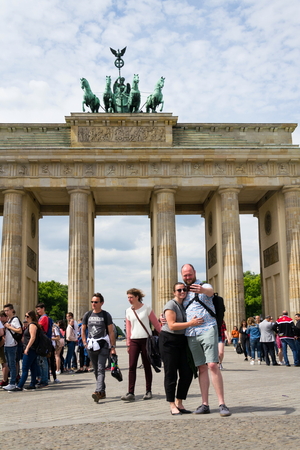 BERLIN, GERMANY - MAY 15 2018: Tourists taking pictures in front of Brandenburger Tor - Brandeburg gate on May 15, 2018 in Berlin, Germany.のeditorial素材