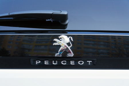 PRAGUE, CZECH REPUBLIC - MARCH 29 2018: Peugeot company logo on silver car on March 29, 2018 in Prague, Czech Republic.のeditorial素材